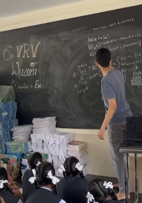 Pointing to an edit-distance calculation on the blackboard.